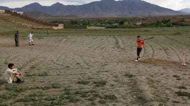 Afghan men play cricket on outskirt of Kabul, Afghanistan May 15, 2017. REUTERS