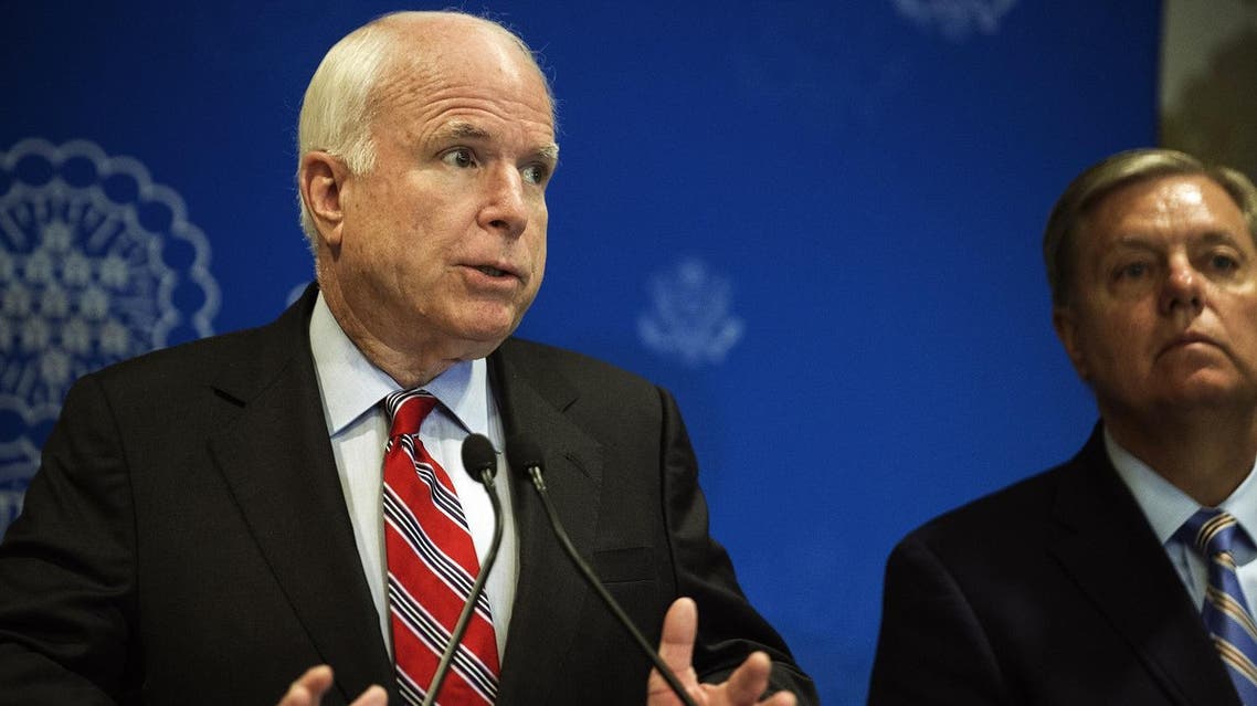 John McCain and Lindsey Graham address a news conference on August 6, 2013 in Cairo, Egypt. (AFP)