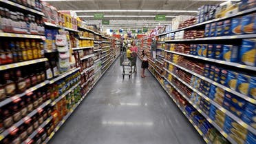 A family shops at the Wal-Mart Neighborhood Market in Bentonville, Arkansas, US on June 4, 2015. (Reuters)
