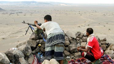 Yemeni fighters loyal to the Saudi-backed Yemeni president hold a hill-top position northwest of the central city of Taiz, on April 20, 2017. SALEH AL-OBEIDI / AFP