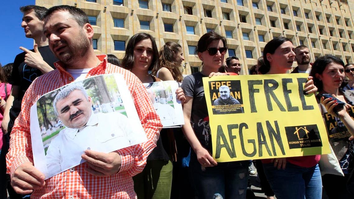 Journalists attend a rally Tbilisi, Georgia, Wednesday, May 31, 2017, to support an Azerbaijani journalist Afgan Mukhtarli, who was abducted in Tbilisi on May 29 and now is in detention in the Azerbaijan capital Baku. (AP)