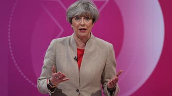 May’s Conservatives send new mixed message on tax as UK election nears