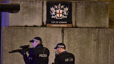 An armed Police officer looks through his weapon on London Bridge in London, Saturday, June 3, 2017. (AP)