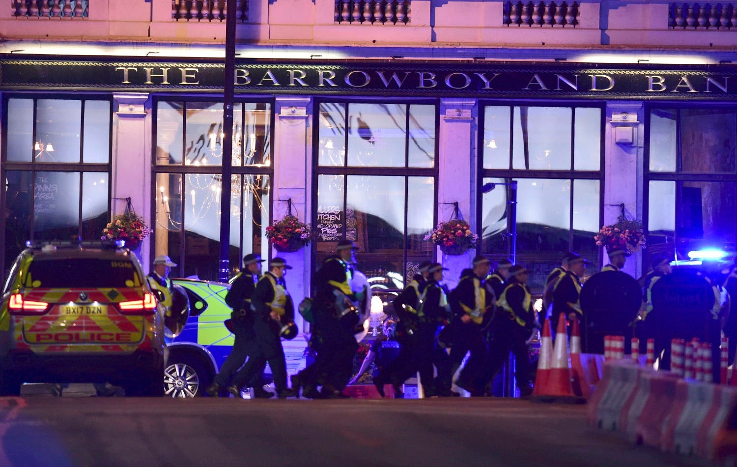 Police Officers walking on Borough High Street as police are dealing with an incident on London Bridge in London, Saturday, June 3, 2017. (AP)