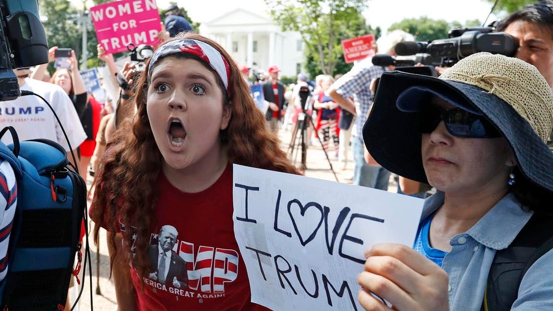 Peyton Price, 14, from La Plata, Md., left, tries to make her point to another person who disagrees with her, during a rally to support President Donald Trump, on June 3, 2017, in Washington. (AP)