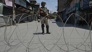 An Indian paramilitary soldier stands guard during a curfew in downtown Srinagar on May 30, 2017. (AFP)