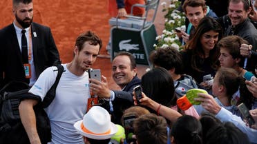 Great Britain’s Andy Murray celebrates with fans after winning his quarter final match against Japan’s Kei Nishikori. (Reuters)