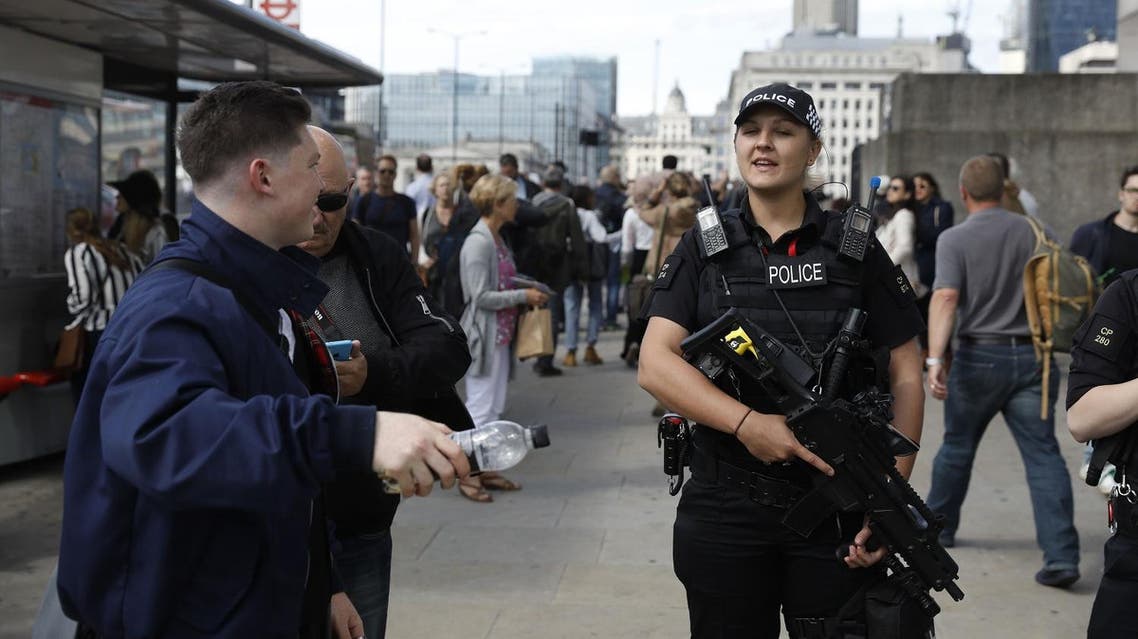 Armed woman police officers patrol on London Bridge in London on June 7, 2017, one of the scenes of the June 3 terror attack. (AFP)