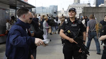 Armed woman police officers patrol on London Bridge in London on June 7, 2017, one of the scenes of the June 3 terror attack. (AFP)