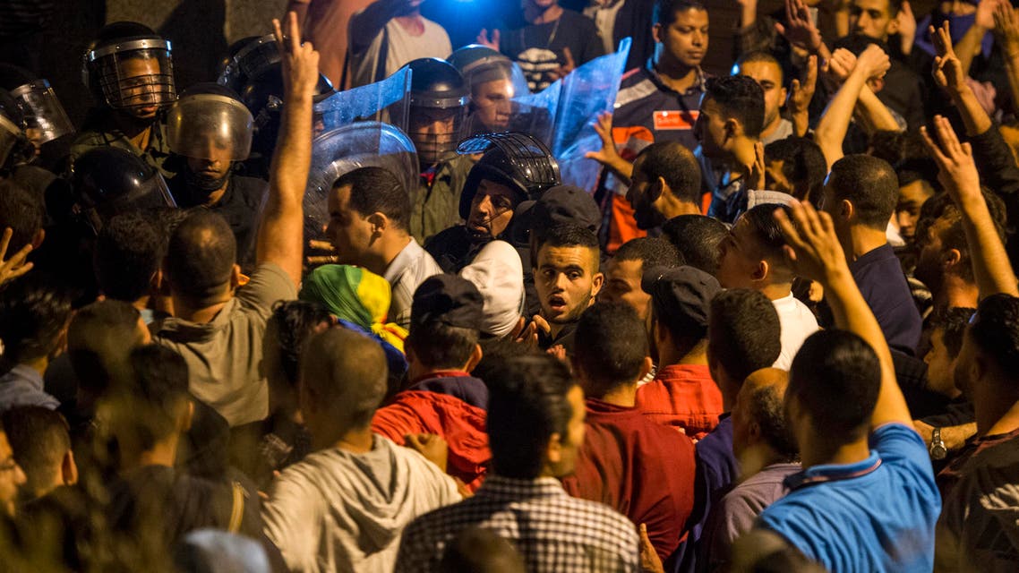 Protesters face security forces during a demonstration against corruption and employment in the northern Rif region, June 8, 2017 in Al Hoceima, Morocco.