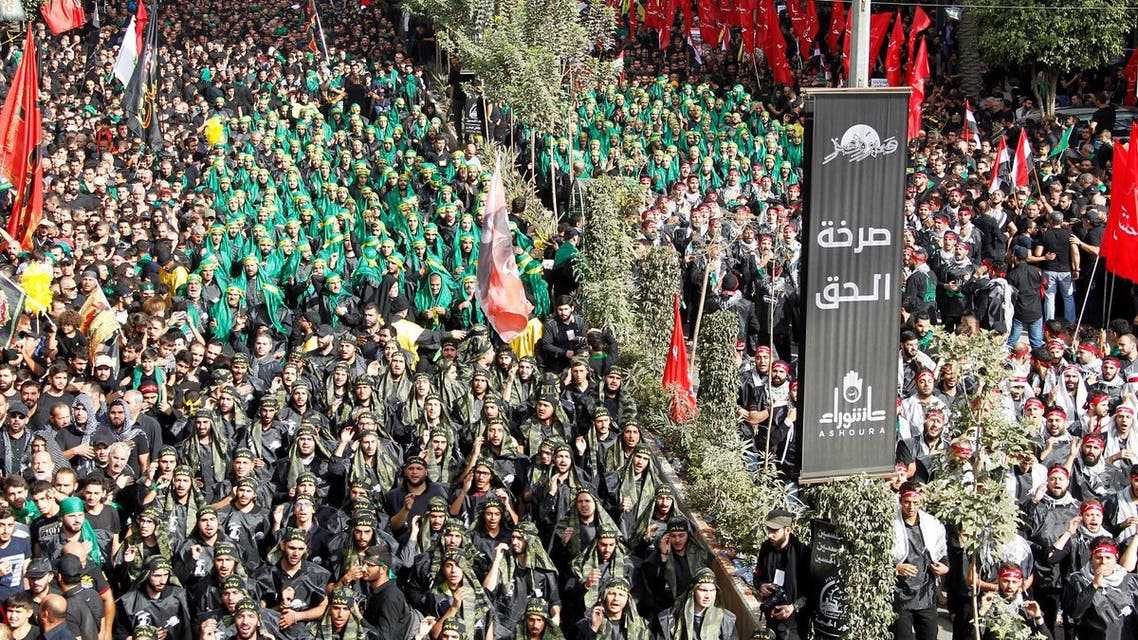 Lebanese Hezbollah supporters gesture during a religious procession to mark Ashura in Beirut’s southern suburbs on October 12, 2016. (Reuters)
