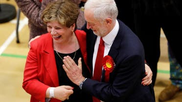 Jeremy Corbyn, leader of Britain’s Labour Party, tries to exchange a high five with Shadow Foreign Secretary Emily Thornberry at the general election counting center. (Reuters)