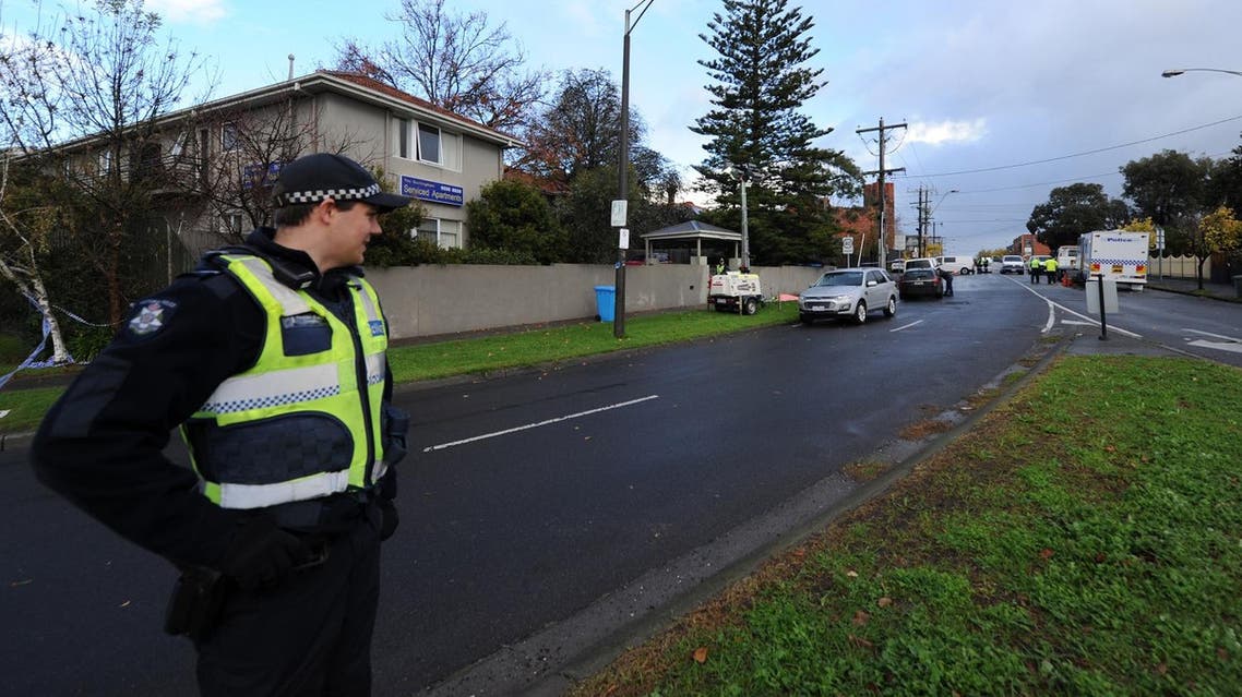 A policeman keeps watch at the scene of a shootout in the Melbourne bayside suburb of Brighton on June 6, 2017. (AFP)