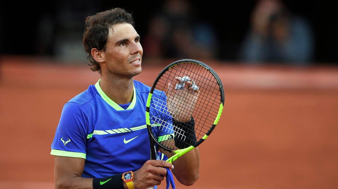 Spain's Rafael Nadal celebrates after winning his semifinal tennis match against Austria's Dominic Thiem at the Roland Garros 2017 French Open on June 9, 2017 in Paris. AFP