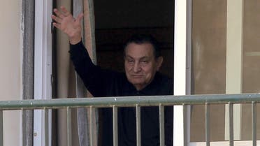Ousted Egyptian president Hosni Mubarak waves to his supporters outside the area where he is hospitalized during his birthday at Maadi military hospital on the outskirts of Cairo May 4, 2015. (Reuters)