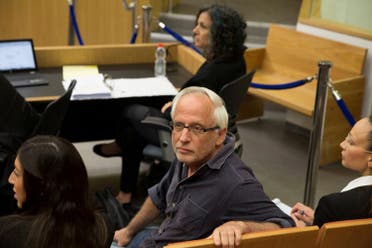 Israeli journalist Yigal Sarna is seen before the arrival of Israeli Prime Minister Benjamin Netanyahu and his wife Sara (not seen) to testify in a libel lawsuit in a Tel Aviv court. (Reuters)
