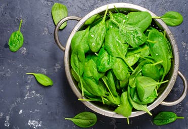 Fresh spinach displayed in a bowl. (Stock Image)