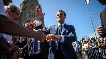 French President Emmanuel Macron leaves polling station after voting in parliamentary elections in Le Touquet. (Reuters)