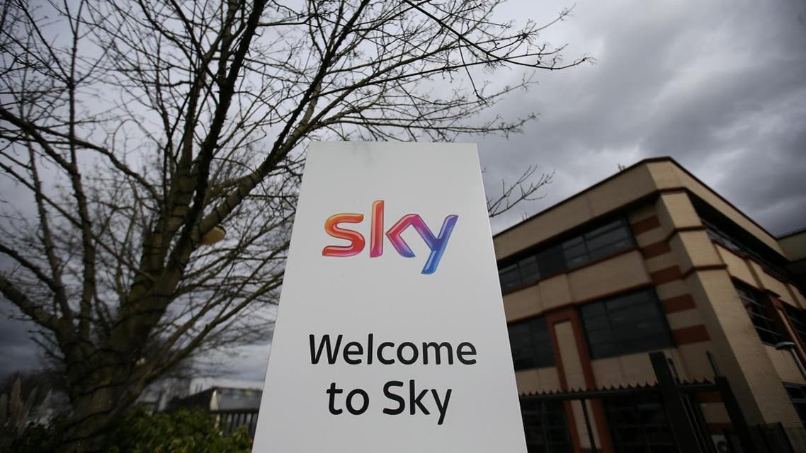 A Sky logo is pictured on a sign next to the entrance to pay-TV giant Sky Plc's headquarters in Isleworth, west London. (AFP)