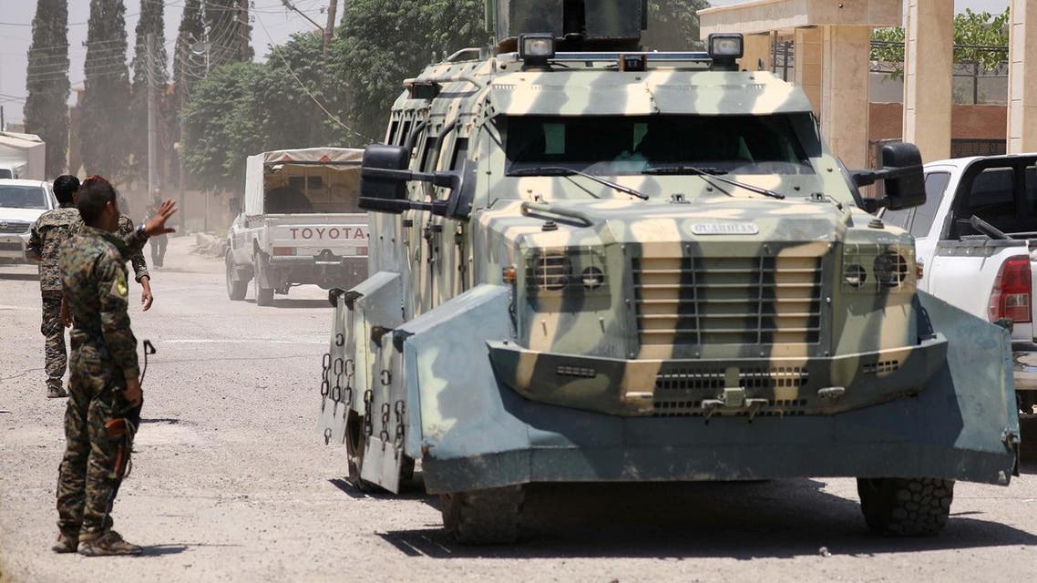 Syrian Democratic Forces (SDF) fighter gestures towards an armoured vehicle in Hawi Hawa village, west of Raqqa, Syria June 11, 2017. (Reuters)