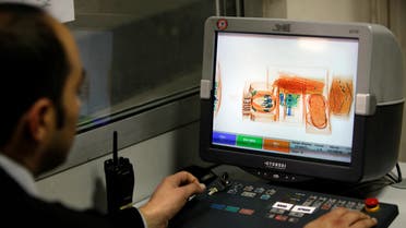 A security official looks at a screen displaying X-ray screened parcels in Turkish Post's (PTT) postal logistic centre at the Ataturk International airport in Istanbul, Turkey on November 6, 2010. (Reuters)