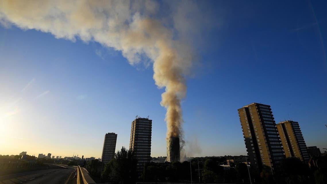 The A40 road is seen closed as flames and smoke billow as firefighters deal with a serious fire in a tower block at Latimer Road in West London, Britain June 14, 2017. (Reuters)