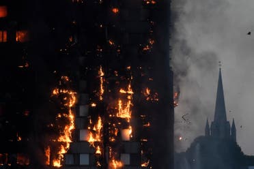 Flames and smoke billow as firefighters deal with a serious fire in a tower block at Latimer Road in West London on June 14, 2017. (Reuters)