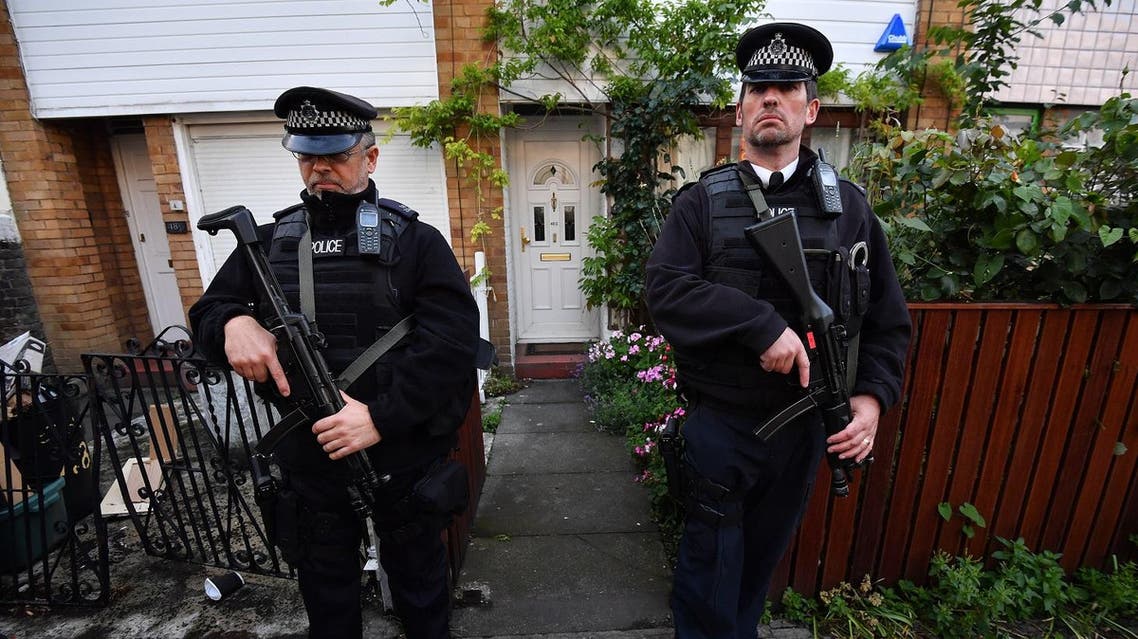 Armed police officers flank the entrance to the London home of Britain's opposition Labour party Leader Jeremy Corbyn on June 9, 2017. AFP