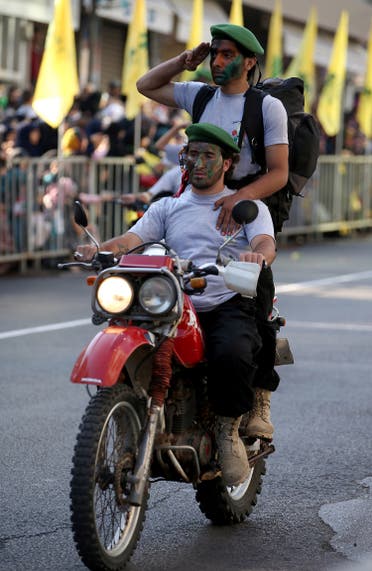 Hezbollah al-Mahdi scouts ride their motorcycle as they parade during an event for Jerusalem day or Al-Quds day, at the southern town of Nabatiyeh, Lebanon, Aug. 1, 2013. (AP)