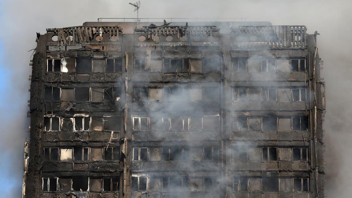 Smoke billows from a tower block severly damaged by a serious fire, in north Kensington, West London. (Reuters)