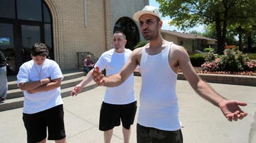 Steven Khoushaba, a Chaldean from Iraq, talks about the seizure of his brother by Immigration and Customs Enforcement agents during a rally in Southfield, Michigan on June 12, 2017. (Reuters)