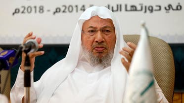 Chairman of the International Union of Muslim Scholars Yusuf al-Qaradawi (R) speaks during a news conference in Doha June 23, 2014. (Reuters)