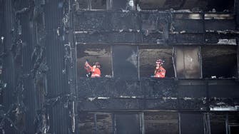 At least 58 feared dead in London tower fire, PM May admits failings