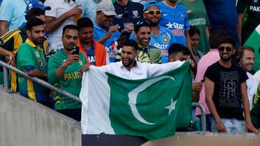 Boxer Amir Khan holds up a Pakistan flag in the stands during the 2017 ICC Champions Trophy Final on June 18, 2017. (Reuters)