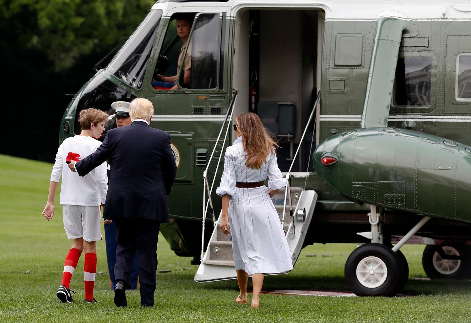 President Donald Trump, first lady Melania Trump, and their son and Barron Trump, board Marine One on the South Lawn of the White House in Washington, Saturday, June 17, 2017, en route to Camp David in Maryland. (AP)