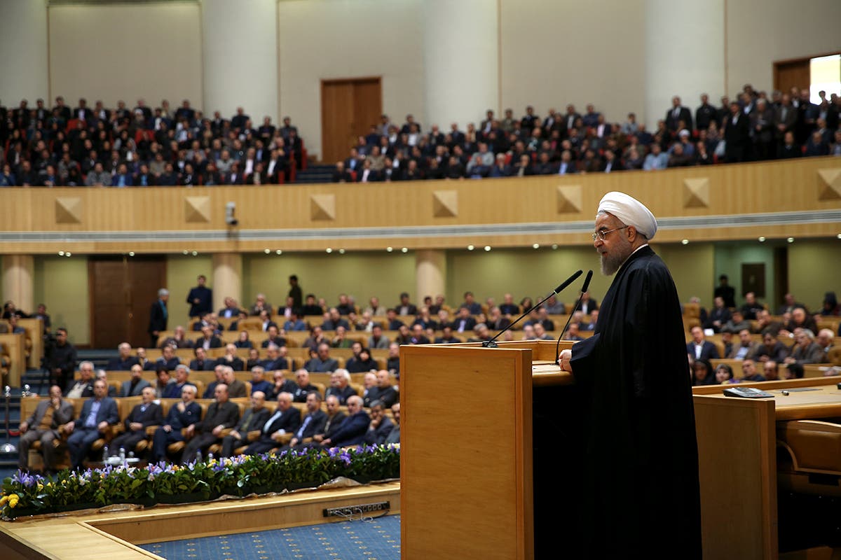 A handout picture provided by the office of Iranian President Hassan Rouhani shows him delivering a speech during a conference entitled “Implementation of Joint Comprehensive Plan of Action (JCPOA) a new chapter in Iran’s economy”, on January 19, 2016, in Tehran. (AFP)