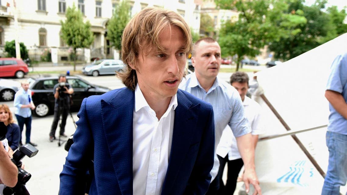 Real Madrid's midfielder Luka Modric arrives at the Osijek courthouse on June 13, 2017 to testify in a multi-million-euro corruption trial against Dinamo Zagreb's ex chairman. The 31-year-old star midfielder is to give evidence at the trial of controversial Zdravko Mamic, considered the most powerful man in Croatian football, who is being tried along with three others: his brother and former Dinamo Zagreb coach Zoran Mamic, former club director Damir Vrbanovic, and a tax inspector. (AFP)
