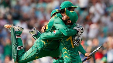 Pakistan's captain Sarfraz Ahmed, left, jumps over a teammate after they defeated India by 180 runs during the ICC Champions Trophy final at The Oval in London, Sunday, June 18, 2017. (AP)