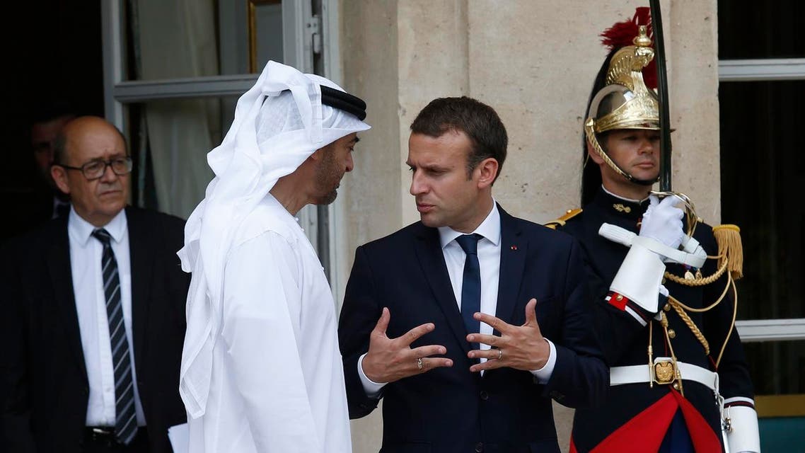 French President Emmanuel Macron (R) gestures as he speaks with The Crown Prince of Abu Dhabi Mohammed bin Zayed al Nayan (2L) as French Foreign Minister Jean-Yves Le Drian (L) looks on after meetings at The Elysee Palace in Paris on June 21, 2017. (AFP)