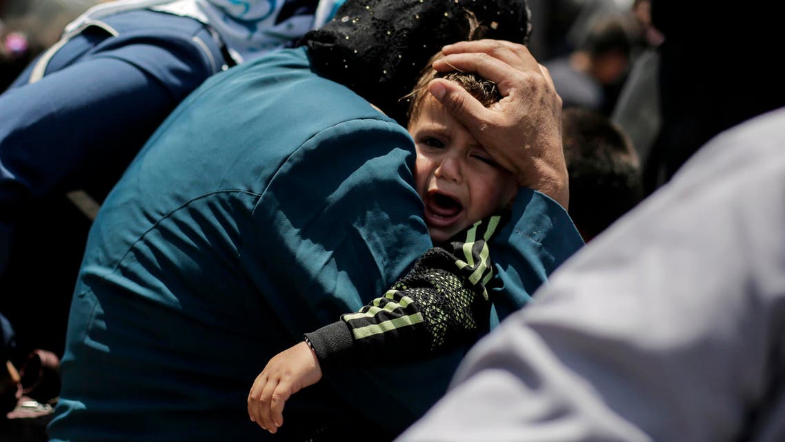 May 5, 2017 file photo, a child cries onboard a ferry crossing the Tigris River, in Mosul, Iraq. (Reuters)