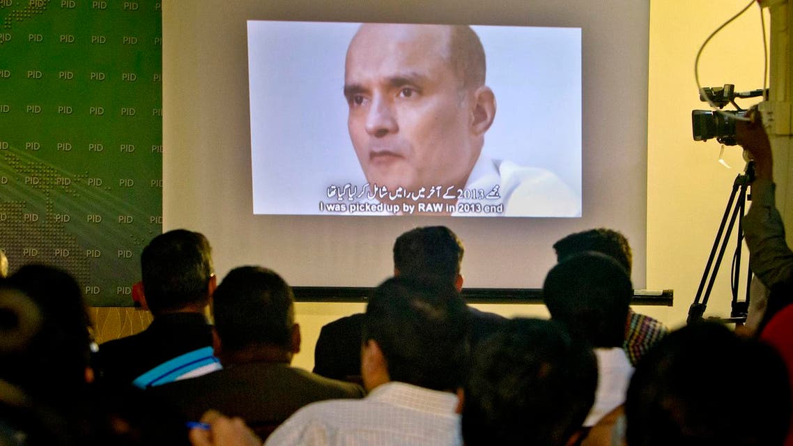 An image of Indian naval officer Kulbhushan Jadhav, who was arrested in March 2016, on display during a press conference by Pakistan’s army spokesman and the Information Minister, in Islamabad, Pakistan. (AP)