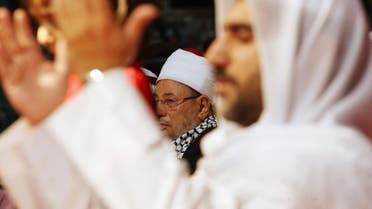 Youssef al-Qaradawi (C) attends a protest against Israel over the recent Israeli attacks on the Gaza Strip, at the Qatar Sports Club in Doha, January 1, 2009. (File photo: Reuters)