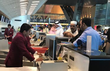 In this Monday, June 12, 2017 photo, Qatari and other nationals queue at the check in counters of the Hamad International Airport in Doha, Qatar. (AP)