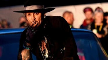  Actor Johnny Depp poses on a Cadillac before presenting his film The Libertine, at Cinemageddon at Worthy Farm in Somerset during the Glastonbury Festival in Britain, June 22, 2017. (Reuters)