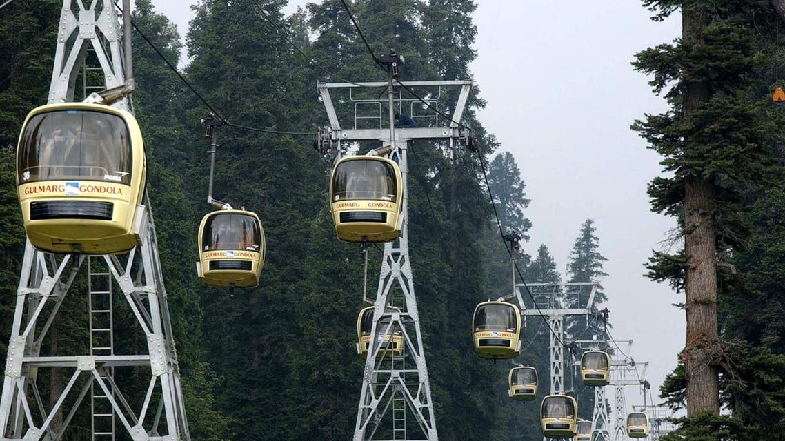 Tourists enjoy cable-car rides at the tourist resort of Gulmarg, 31 miles north of Srinagar, India. (AP)