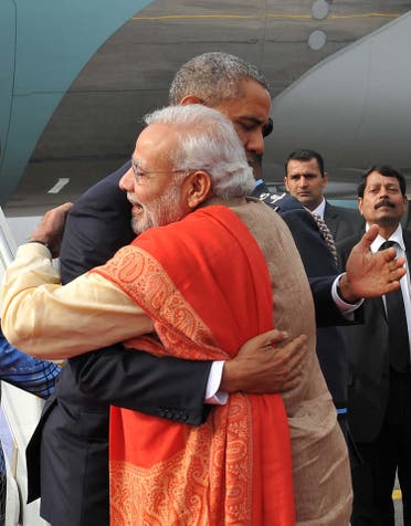 Modi and Obama hug as the then US president arrives in New Delhi on January 25. (AFP)