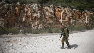 An Israeli soldier walks near the area where the Israeli army is excavating part of a cliff to create an additional barrier along its border with Lebanon, near the community of Shlomi in northern Israel April 6, 2016. Israeli Defence Forces (IDF) Lieutenant-General Eli David, who serves as an engineering officer in a northern division, told Reuters on Wednesday that the army began work on the new barrier by exposing the cliff in January 2015, to help protect communities located close to the Lebanese border from infiltrators. REUTERS/Ronen Zvulun TPX IMAGES OF THE DAY