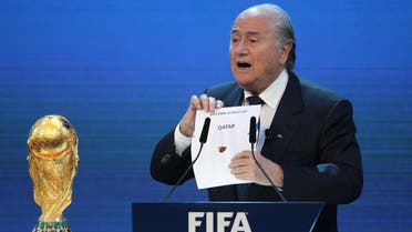 FIFA president Joseph Blatter opens the envelope to reveal that Qatar will host the 2022 World Cup at the FIFA headquarters in Zurich on December 2, 2010. Qatar became the first Arab, Middle Eastern or Muslim country to be awarded the right to stage football's World Cup. AFP PHOTO/KARIM JAAFAR 