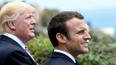 US President Donald Trump (L) and French President Emmanuel Macron watch an Italian flying squadron as they attend the Summit of the Heads of State and of Government of the G7, the group of most industrialized economies, plus the European Union, on May 26, 2017 in Taormina, Sicily. The leaders of Britain, Canada, France, Germany, Japan, the US and Italy will be joined by representatives of the European Union and the International Monetary Fund (IMF) as well as teams from Ethiopia, Kenya, Niger, Nigeria and Tunisia during the summit from May 26 to 27, 2017. (AFP)