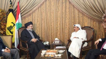 Hezbollah leader Sayyed Hassan Nasrallah (2nd L) speaks with Qatar's Prime Minister and Foreign Minister Sheikh Hamad bin Jassim bin Jaber al-Thani (2nd R), as Turkey's Foreign Minister Ahmet Davutogluat (R) and Hezbollah official Hussein al-Khalil listen during their meeting in Beirut, January 18, 2011. reuters